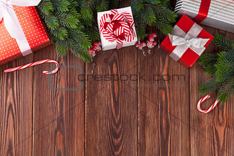 Christmas gift boxes and fir tree branch