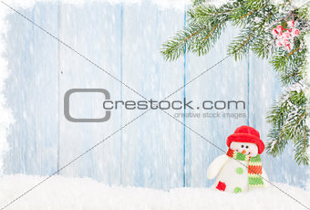 Christmas snowman toy and fir tree