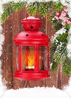 Christmas candle lantern on fir tree branch