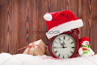 Christmas gift box, snowman and alarm clock