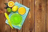 Citrus fruits and glass of juice