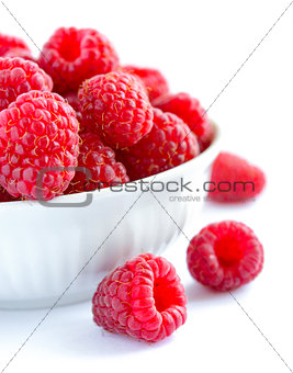 Big Pile of Fresh Raspberries in the White Bowl Isolated on White Background