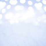 Empty Christmas Decoration with Snow and Background of Blurred Holiday Lights