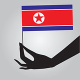 Hand with flag North Korea