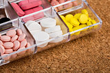 Various pills in plastic container