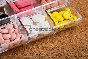 Various pills in plastic container