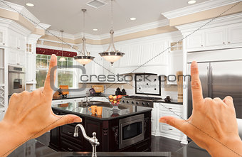 Hands Framing A Beautiful Custom Kitchen