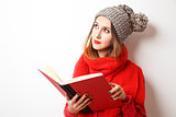 Lovely Hipster Girl in Winter Clothes with Book