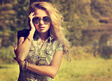 Trendy Hipster Girl on Summer Nature Background