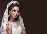Beautiful brunette girl in image of Arab bride, wedding dress and crown on her head. Beauty face.