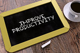 Improve Productivity - Chalkboard with Motivation Quote.