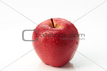 Red apple with droplet isolated on white