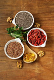 Super food - goji berries, chia seeds, flax seeds, walnuts and omega-3 capsules