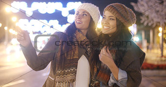 Two vivacious young women laughing and having fun