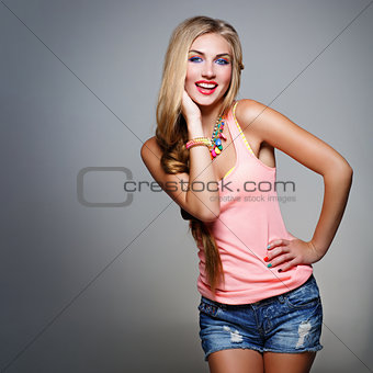 Girl in top and jeans shorts