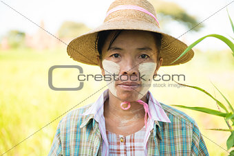 Traditional mature Asian female farmer
