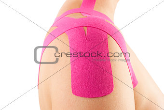 Kinesio tape on female shoulder