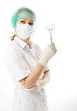 beautiful young female doctor in medical gown and rubber gloves holding a medical clamp. nurse