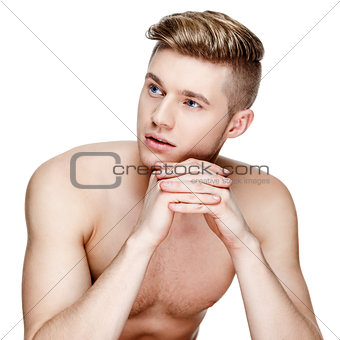 Young shirtless man isolated on white
