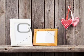 Two photo frames and Valentines day hearts