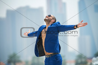 Man on the background of skyscrapers