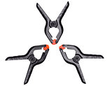 Plastic black-orange clamps on white