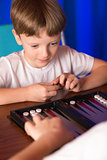 boy playing a board game called Backgammon