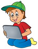 Boy playing with tablet