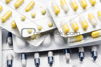 Lot pill packs of colorful tablets and capsules