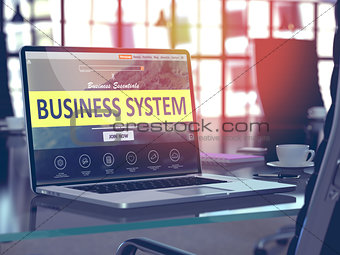 Business System on Laptop in Modern Workplace Background.