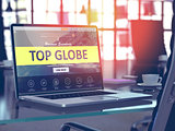 Top Globe Concept on Laptop Screen.