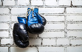 Boxing gloves on brick wall 