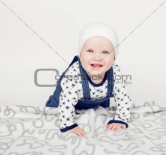 little cute baby toddler on carpet isolated close up smiling