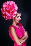 Girl with big pink flower on head
