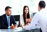Business people speaking during interview in their office