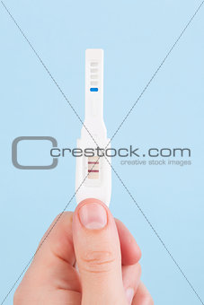 Father holding pregnancy test isolated.
