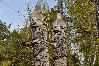 Two heads of wooden idols in the wood