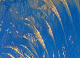 Sparkling ice-rich frosty pattern of thin ice on the window.