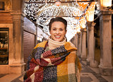 Portrait of woman standing under Christmas light in Venice