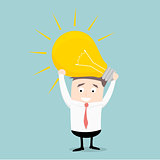 businessman holding lightbulb