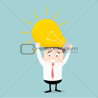 businessman holding lightbulb