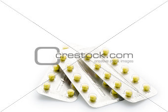 Yellow round pill blister pack