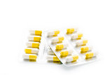 Yellow capsules pill blister pack