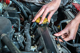 Female car mechanic in auto repair service