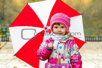 Portrait of a little girl with an umbrella