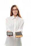 Young woman with book and tablet