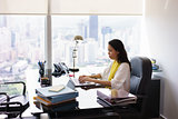 Business Woman Secretary Typing On Laptop Computer In Office