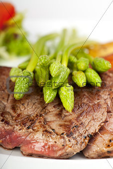 wild asparagus on a steak 