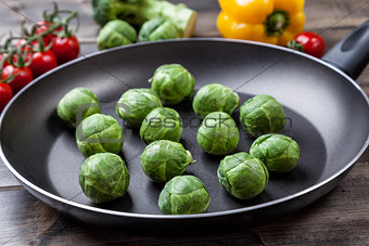 Fresh organic brussel sprouts in a frying pan
