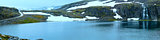 Summer mountain panorama with lake and snow (Norway)